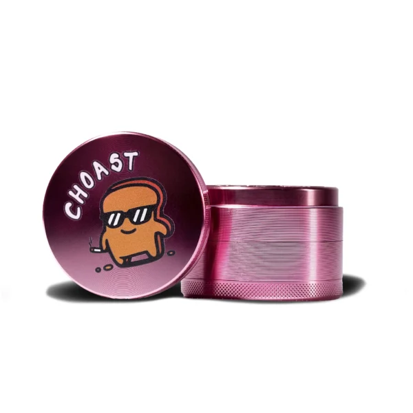 Our Pink 4 piece grinder. Showcasing the top part of the grinder by itself with the choast logo on it. Beside the top part of the grinder is the rest of the body put together