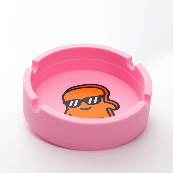Our Pink Silicone Ashtray showcasing the grooves where you can hold your smoke.