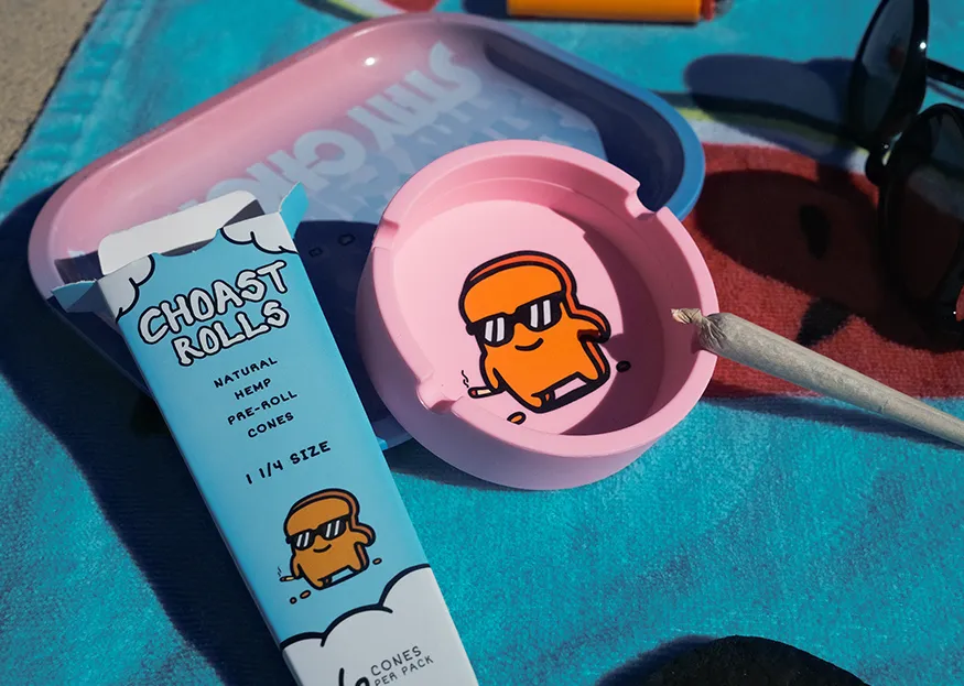 Our portable silicone ashtray sitting next to our Choast Rolls hemp cones.